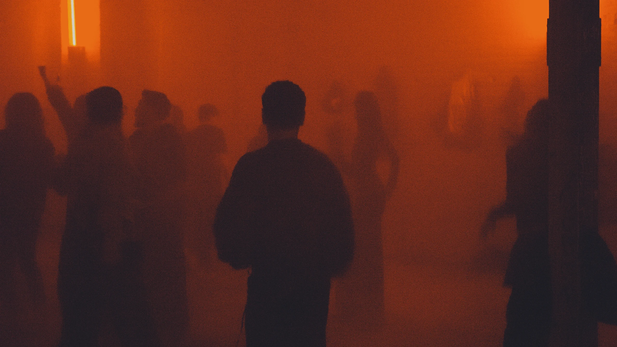 Cloudy atmosphere with people in an orange haze.